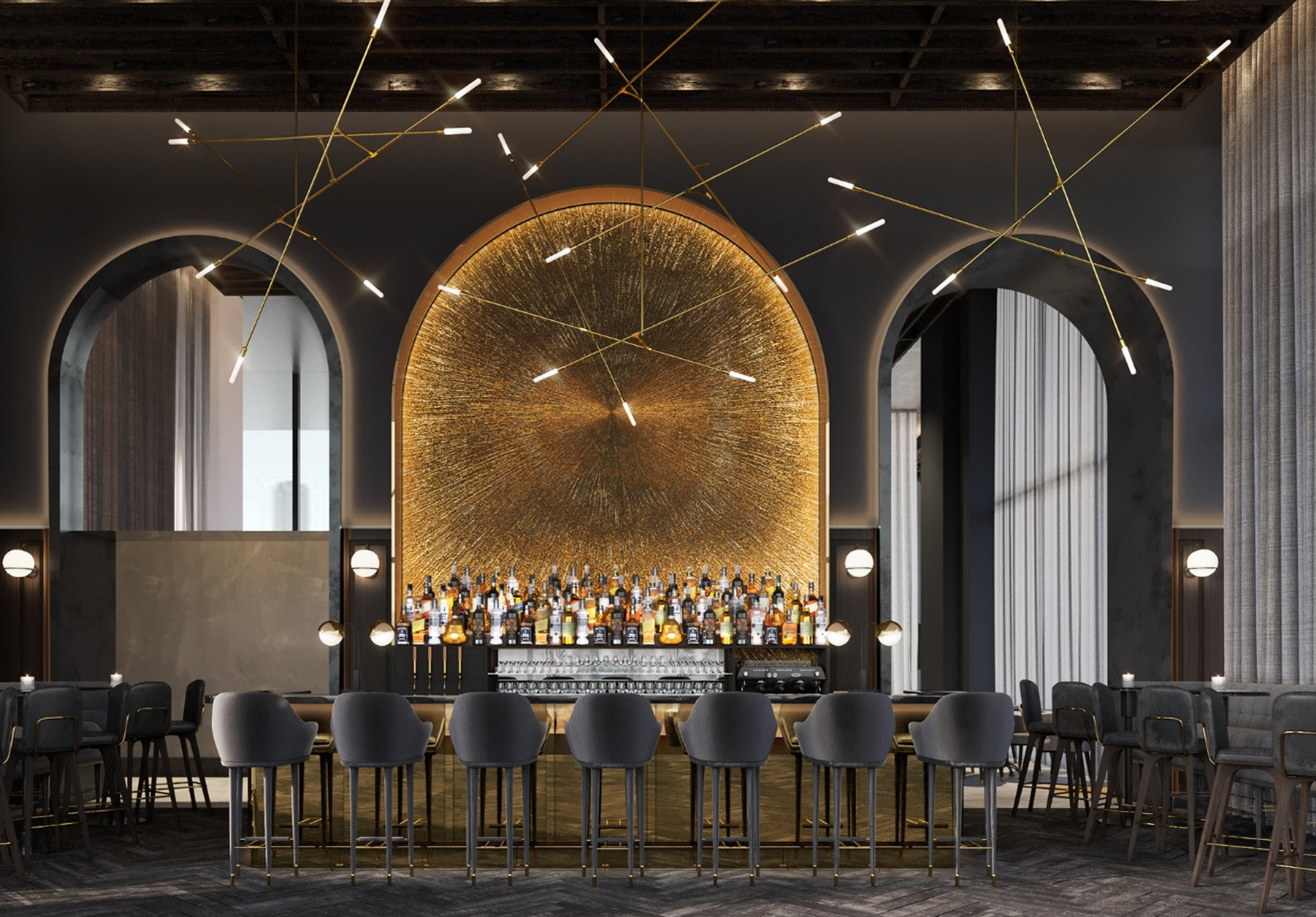 A luxurious hotel bar at voco Melbourne Central featuring plush grey stools, a gold-arched backlit bottle display, moody lighting and contemporary gold starburst chandeliers—offering a stylish setting for cocktails in Melbourne's CBD.